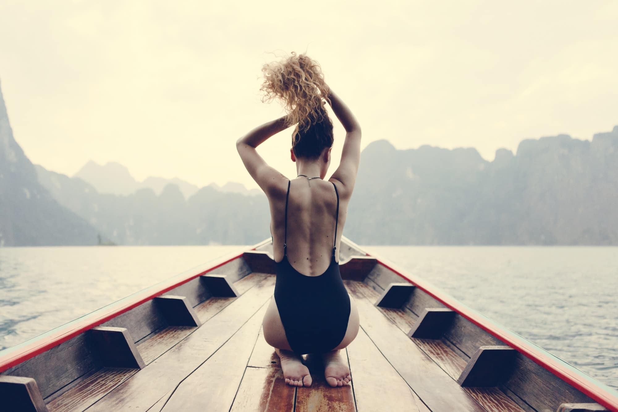 Beautiful woman posing on a boat